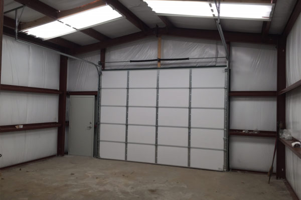 Capital Steel Outbuilding with Sectional Door