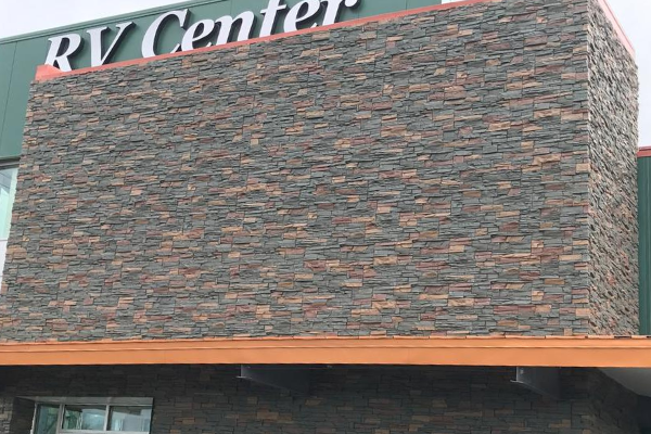 This metal building was covered with GenStone faux stone.